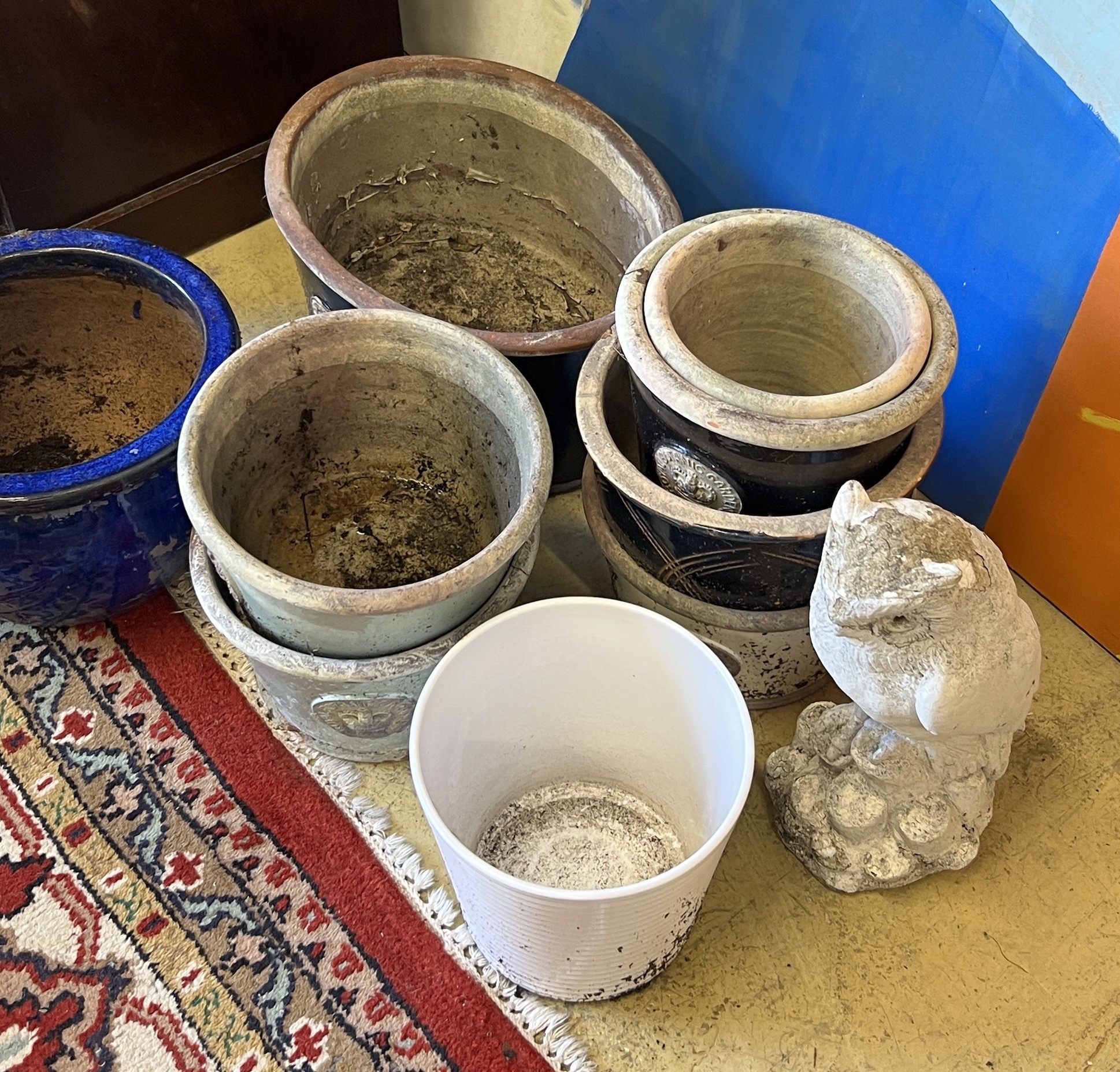 Ten assorted planters and a reconstituted stone owl garden ornament, largest width 38cm